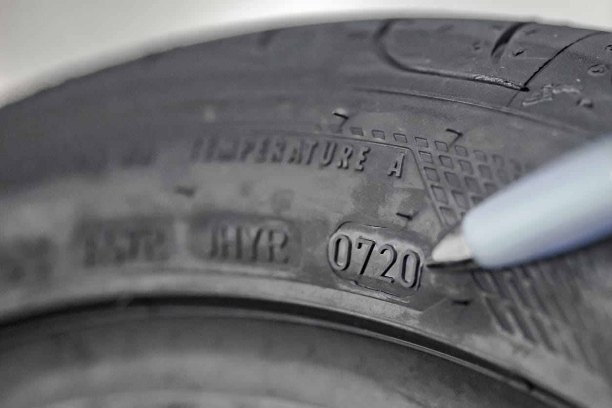 Showing DOT (date of manufacturing) number on a new tire